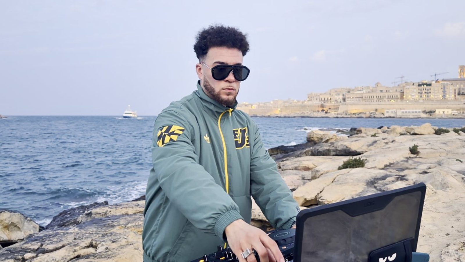DJ RHUE performing beside the water at Manoel Island, Malta